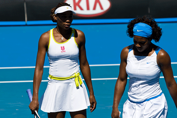 Venus and Serena Williams Playing Doubles