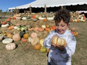 Osama, who was born with NPC, in a pumpkin patch