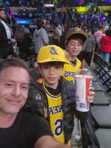 Peter and his sons at a basketball game. Both Peter and one son have HoFH