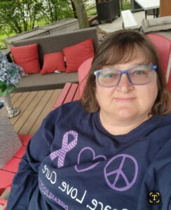 Pam, who has systemic mastocytosis, smiles at the camera