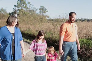 Picture of the Ralph Family walking. Click to read the article.